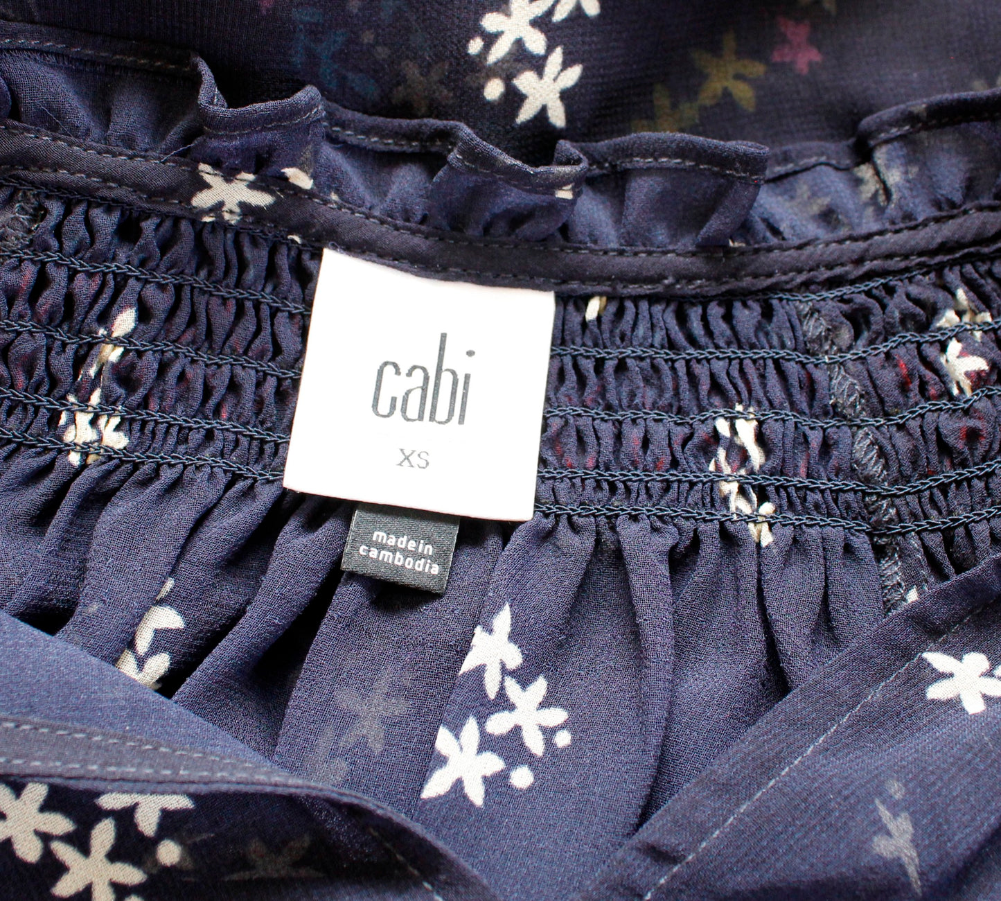 CAbi Enjoy Top Navy Blue Sheer Floral Embroidered Smocked Tie Neck Top Size XS